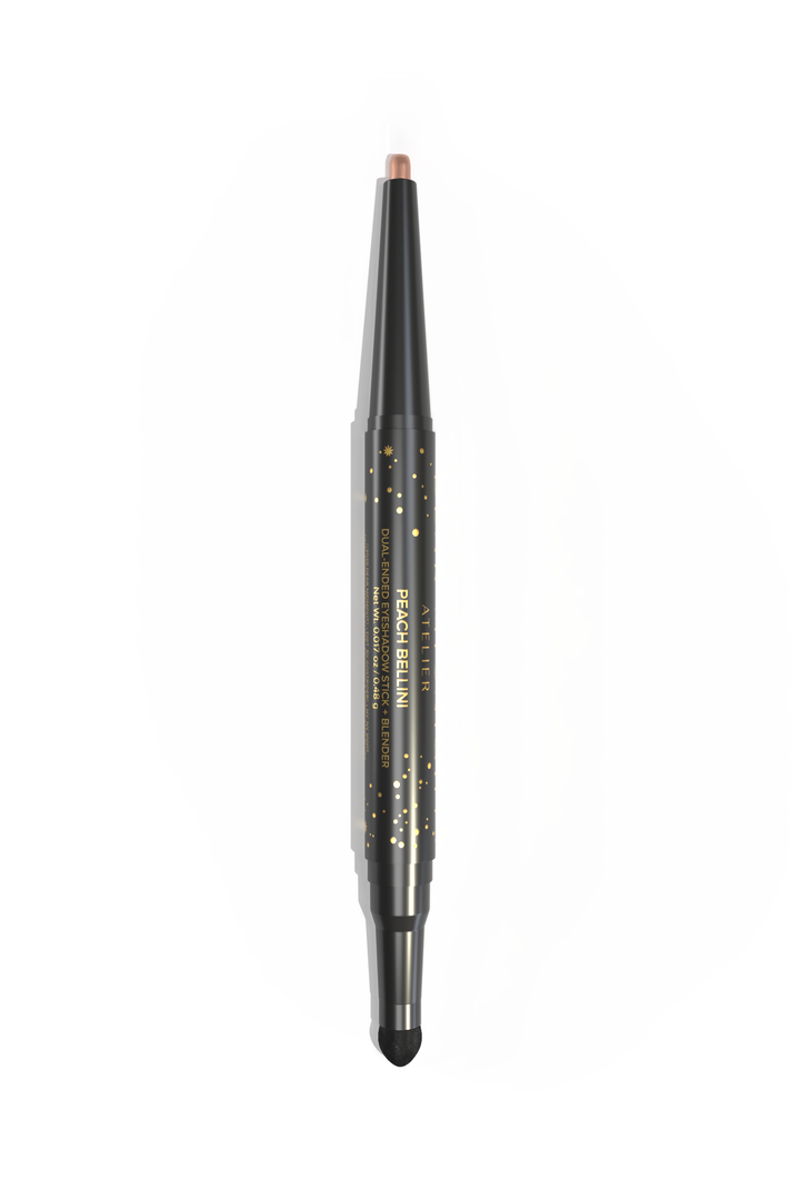 A dual-ended, twist-up eyeshadow pencil and sponge tip applicator in the shade, Peach Bellini, on a white background. 